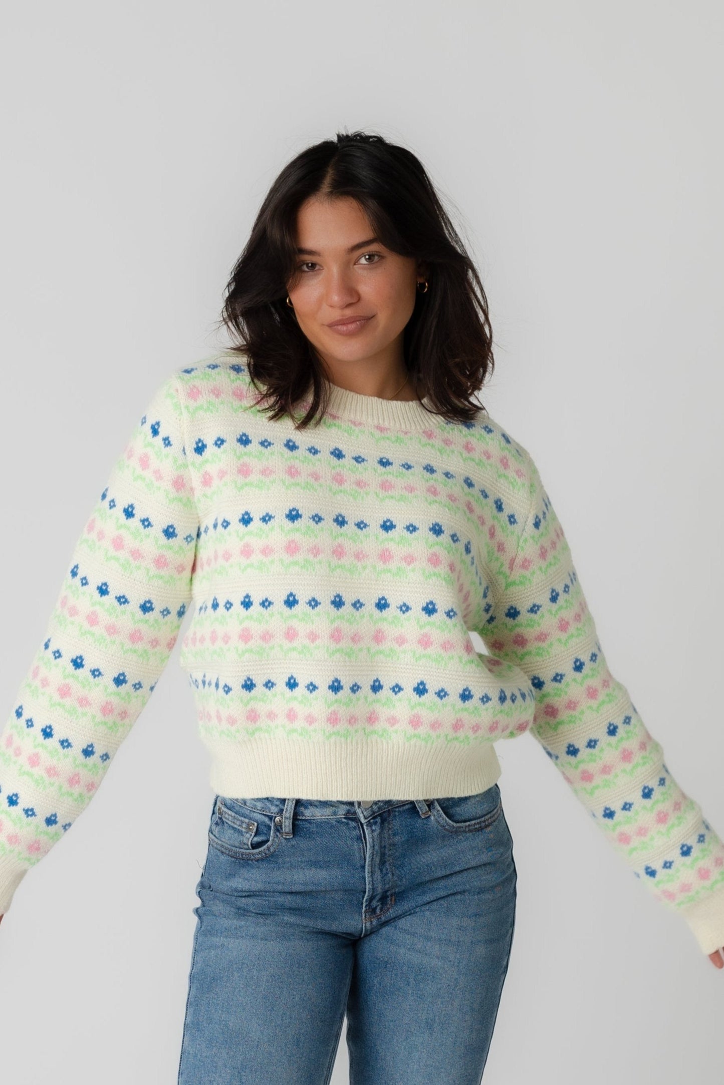 Cream sweater with multicolor pattern