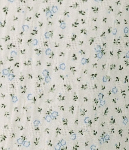 White floral print fabric swatch.