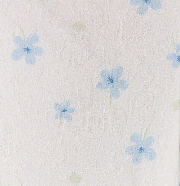 White floral print fabric swatch.