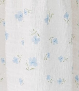 White with blue floral print fabric swatch.