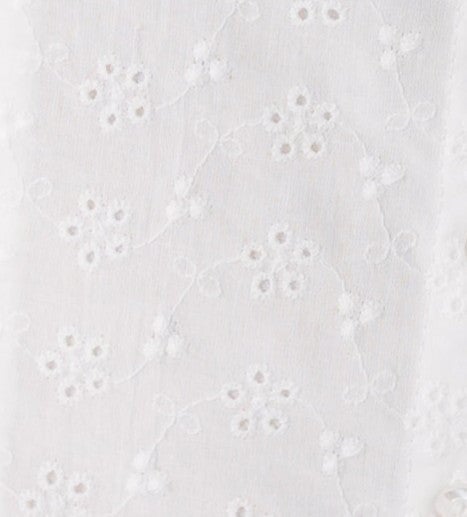 White eyelet fabric swatch.
