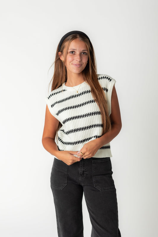 White sweater vest with black textured stripes