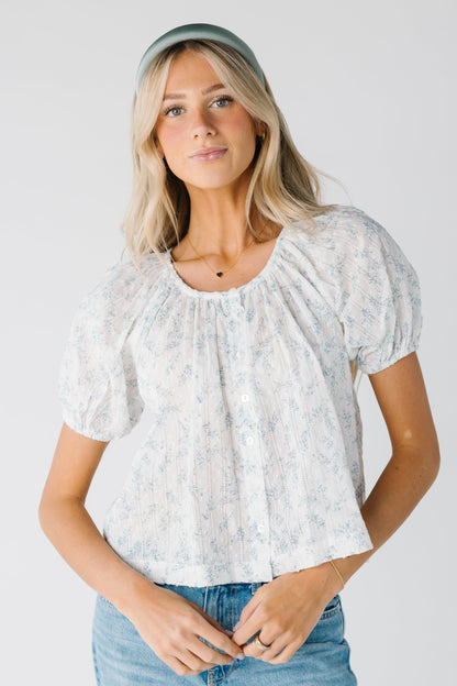 Modest lightweight woven top with blue floral print with scoop neckline and short sleeves