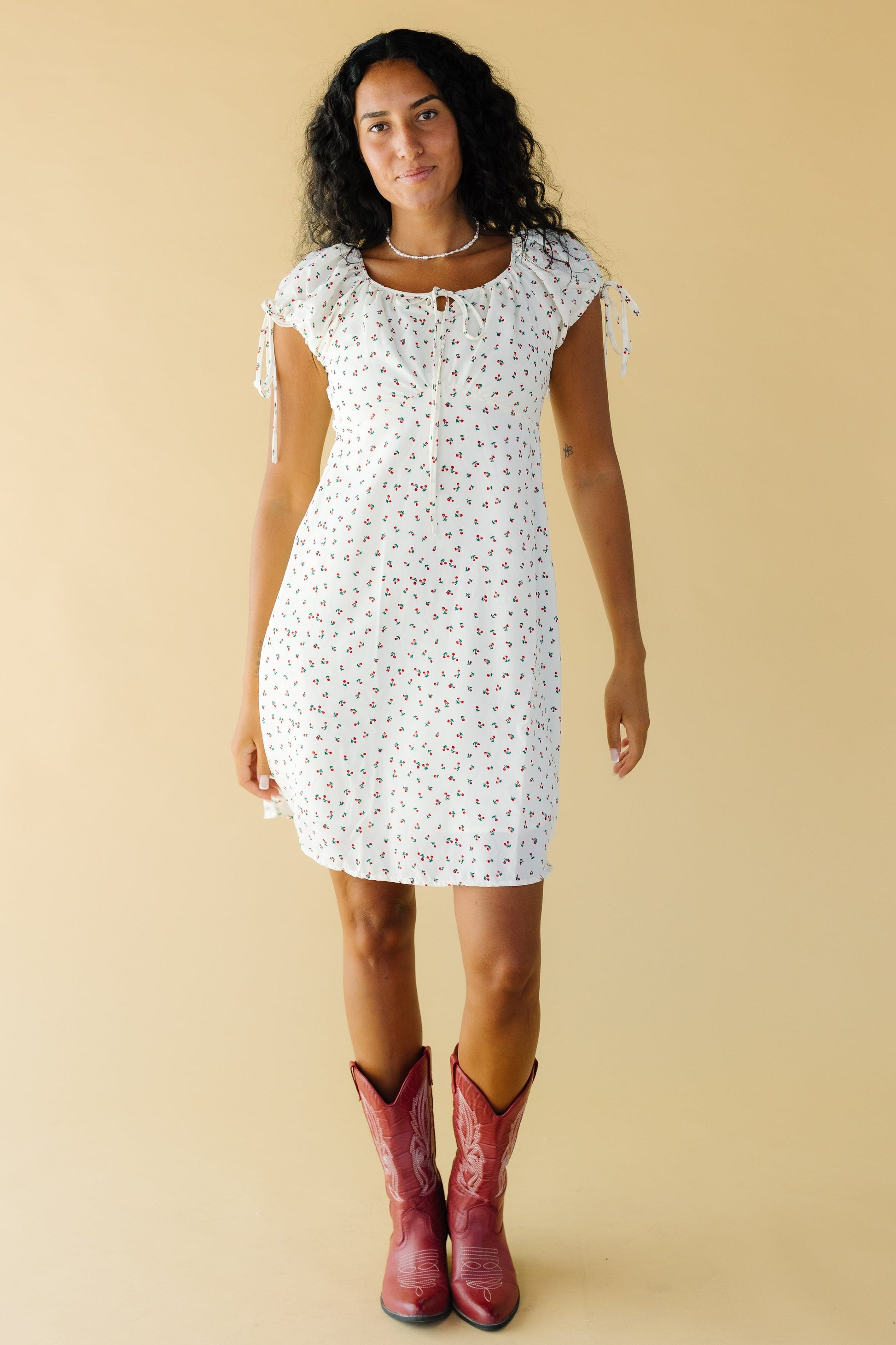 Brass & Roe Tali Knee Dress in cream and red floral print for women and teenage girls.