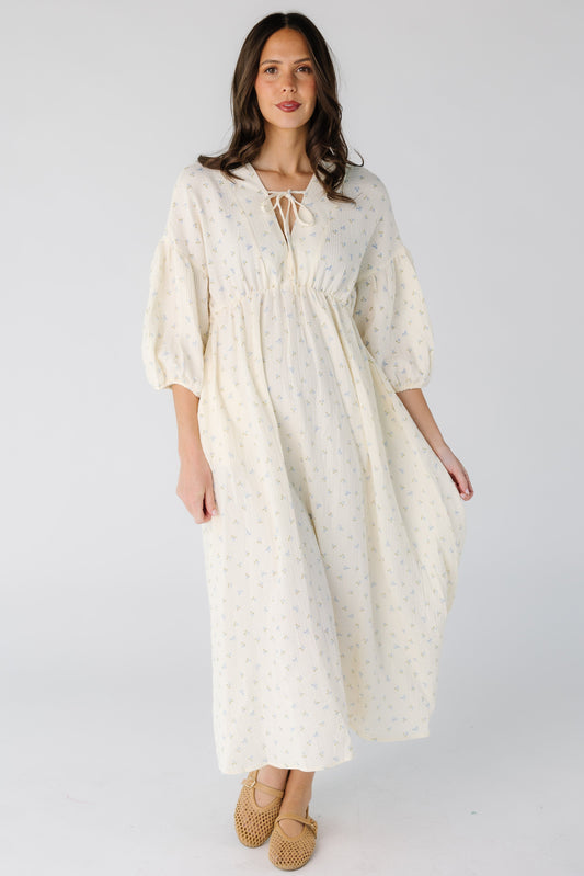 Brass & Roe The Gauze Tie Front Dress for women in cream with a blue floral print for woman.