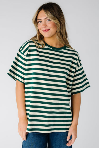 Woman wearing a modest short sleeve stripe tee in green with a crew neckline