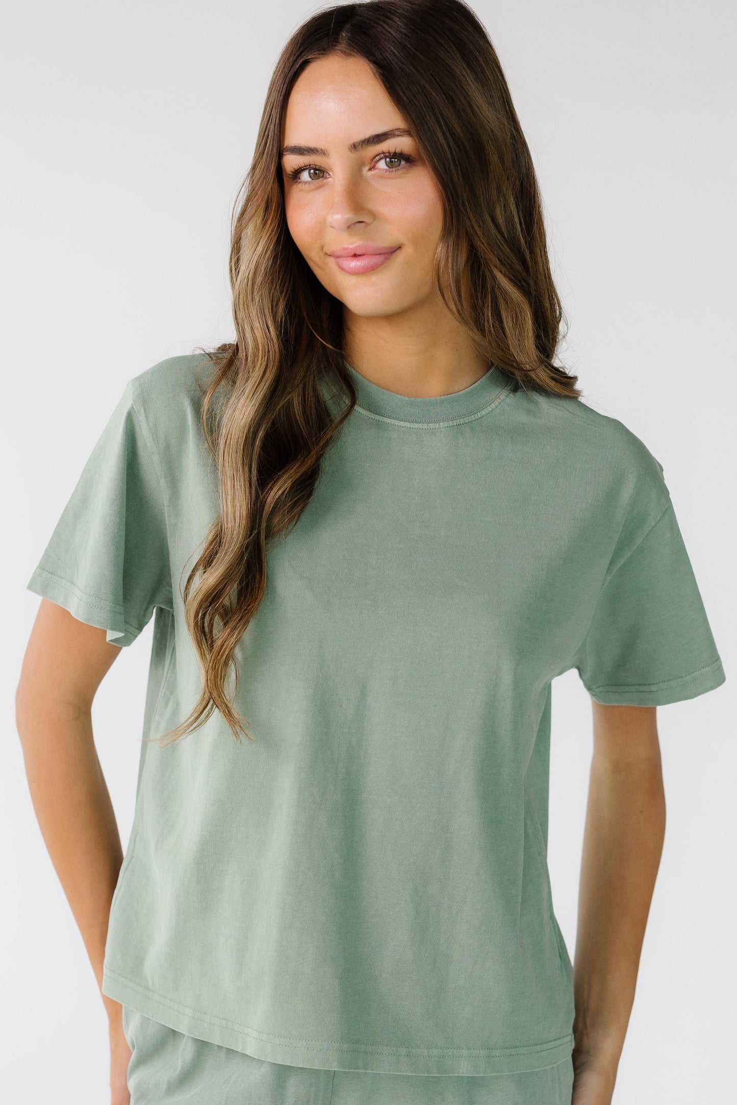 The Classic Cotton Tee in sage green for women and teens.