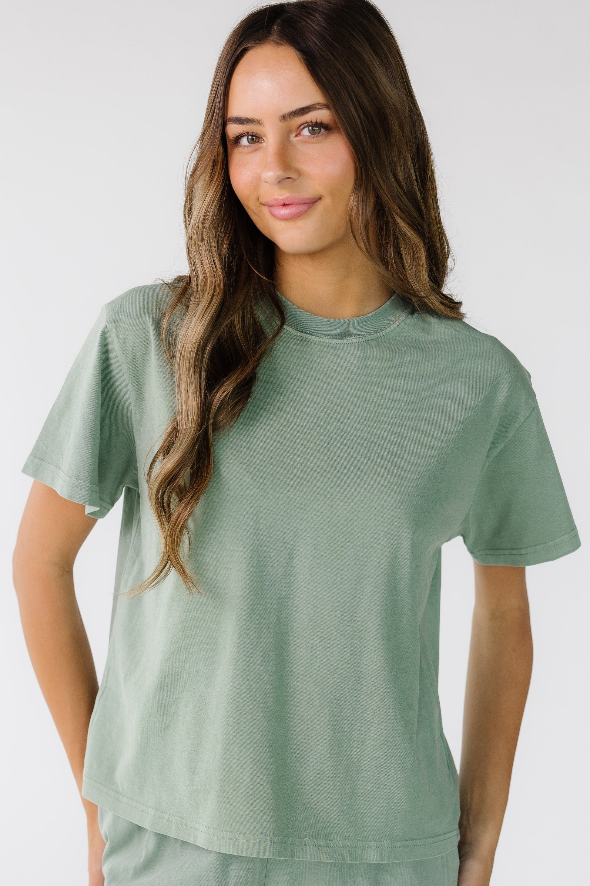 The Classic Cotton Tee in sage green for women and teens.