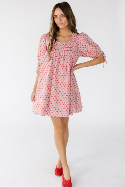 Brass & Roe Nina Cherry Knee Dress in a pink cherry print for women and teens.
