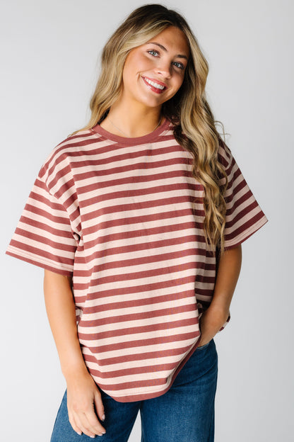 Woman wearing  loose fitting boxy tee with short sleeves