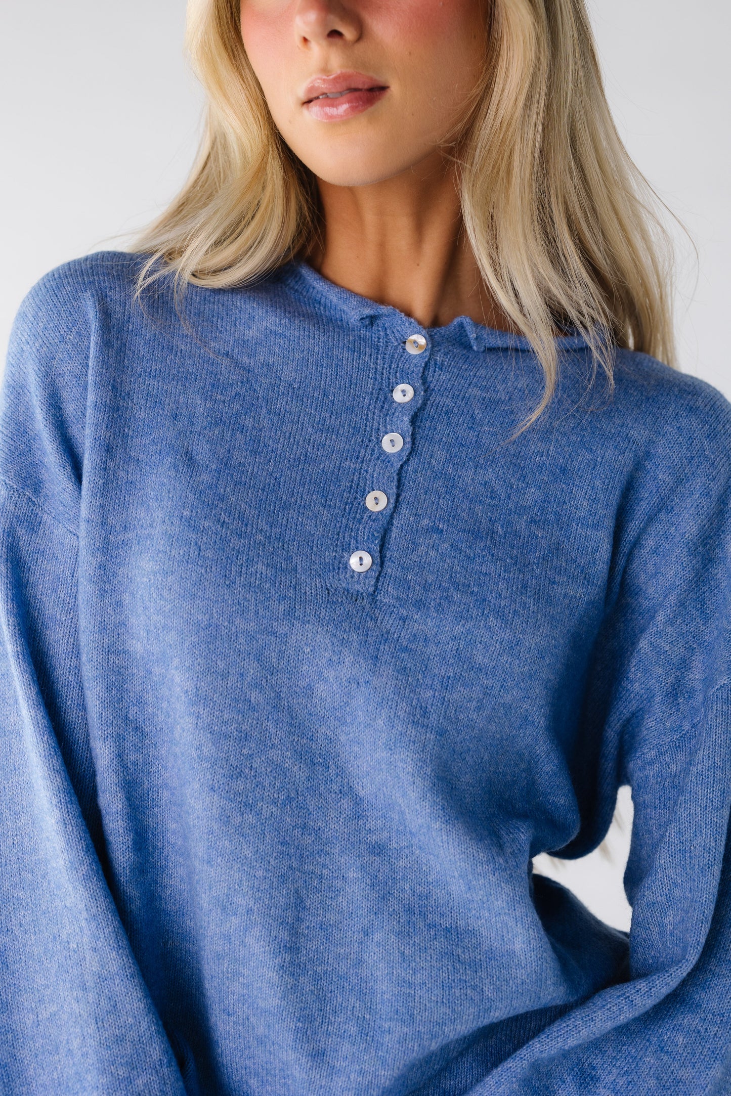 Light blue sweater with short button placket