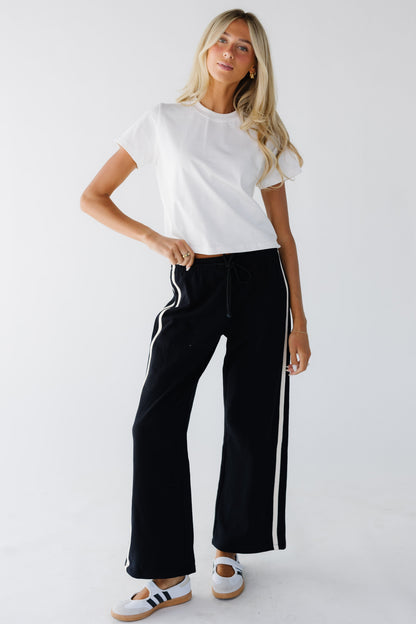 Victory Stripe Pants in black with white stripes for women and teenage girls.