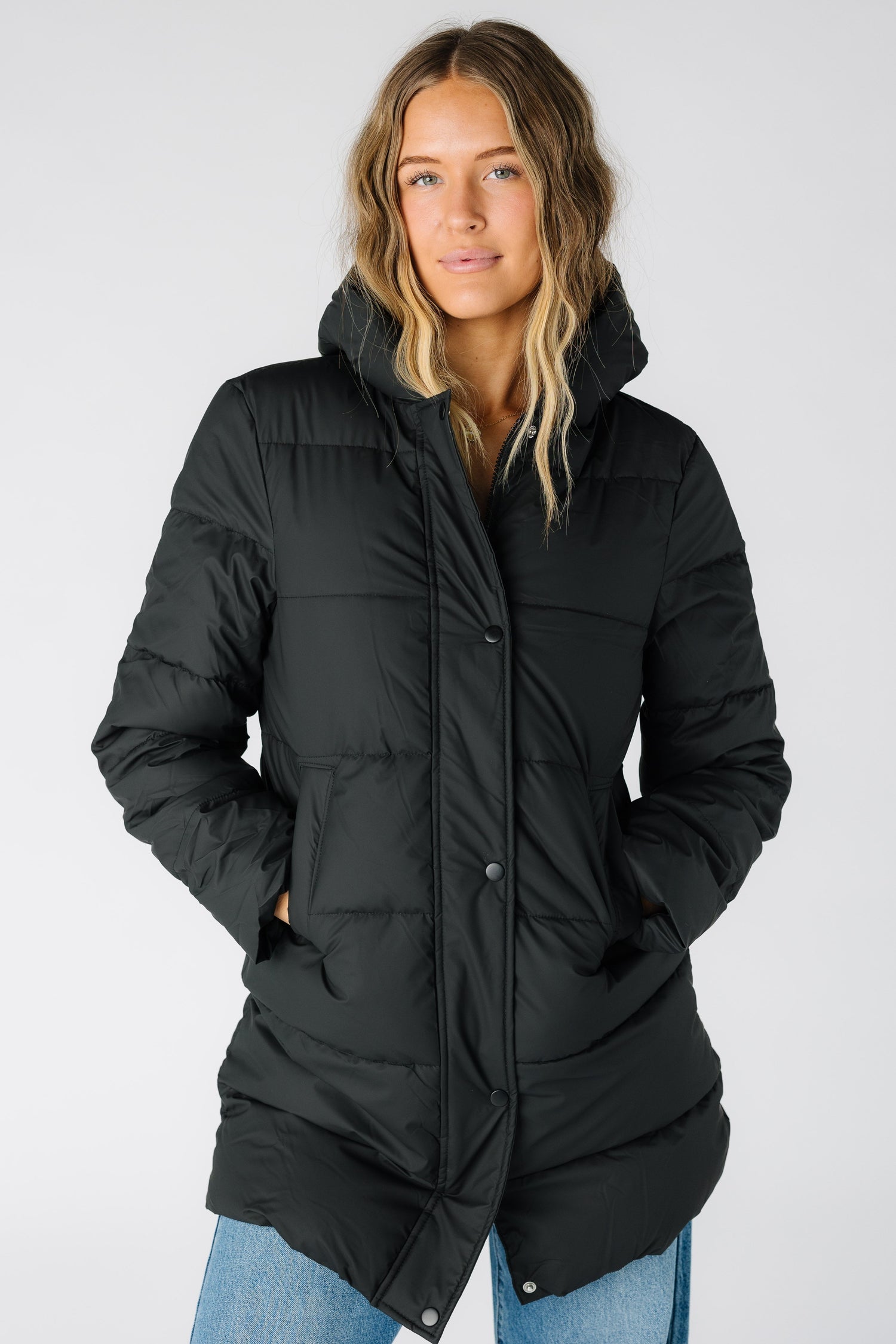 The Aspen Slope Puffer Long Jacket in black for women and teens