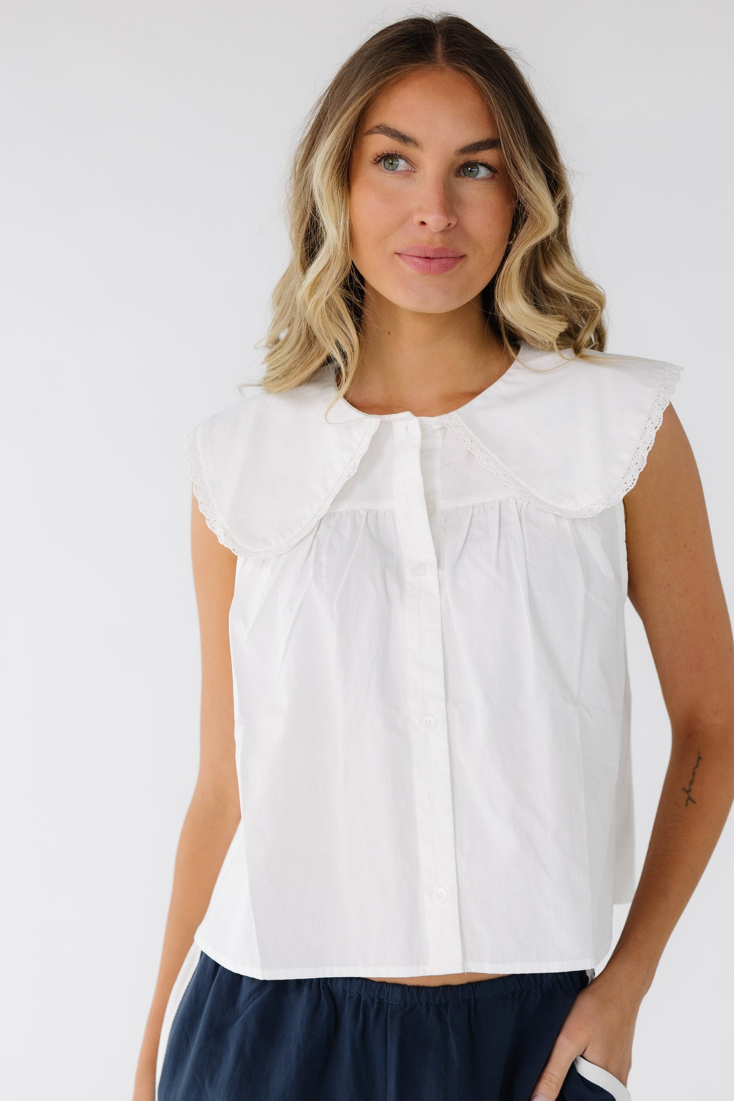 The Elite Top in white for women and teenage girls.