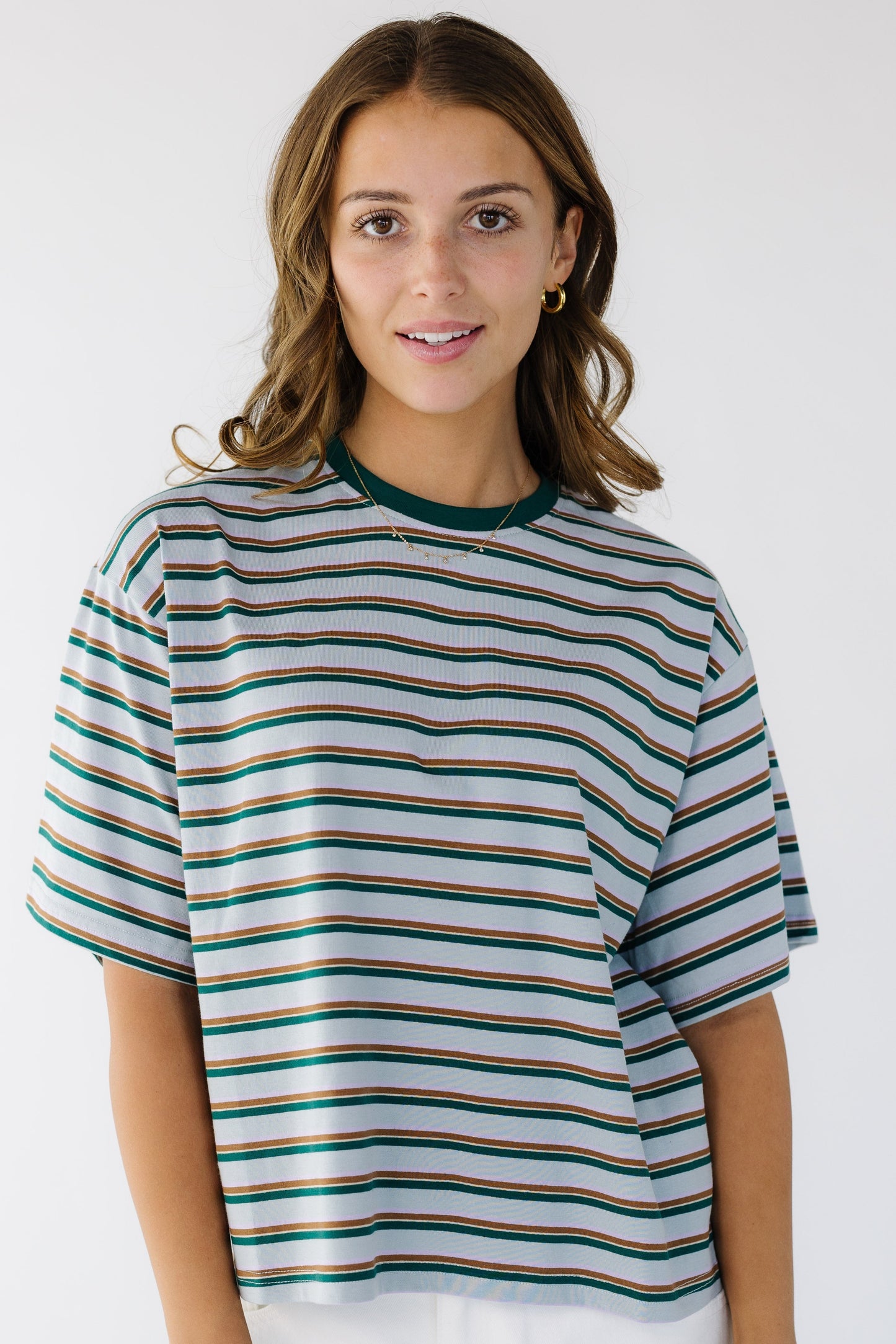 The Stella Top in light blue with green & blue stripes for women and teen girls.