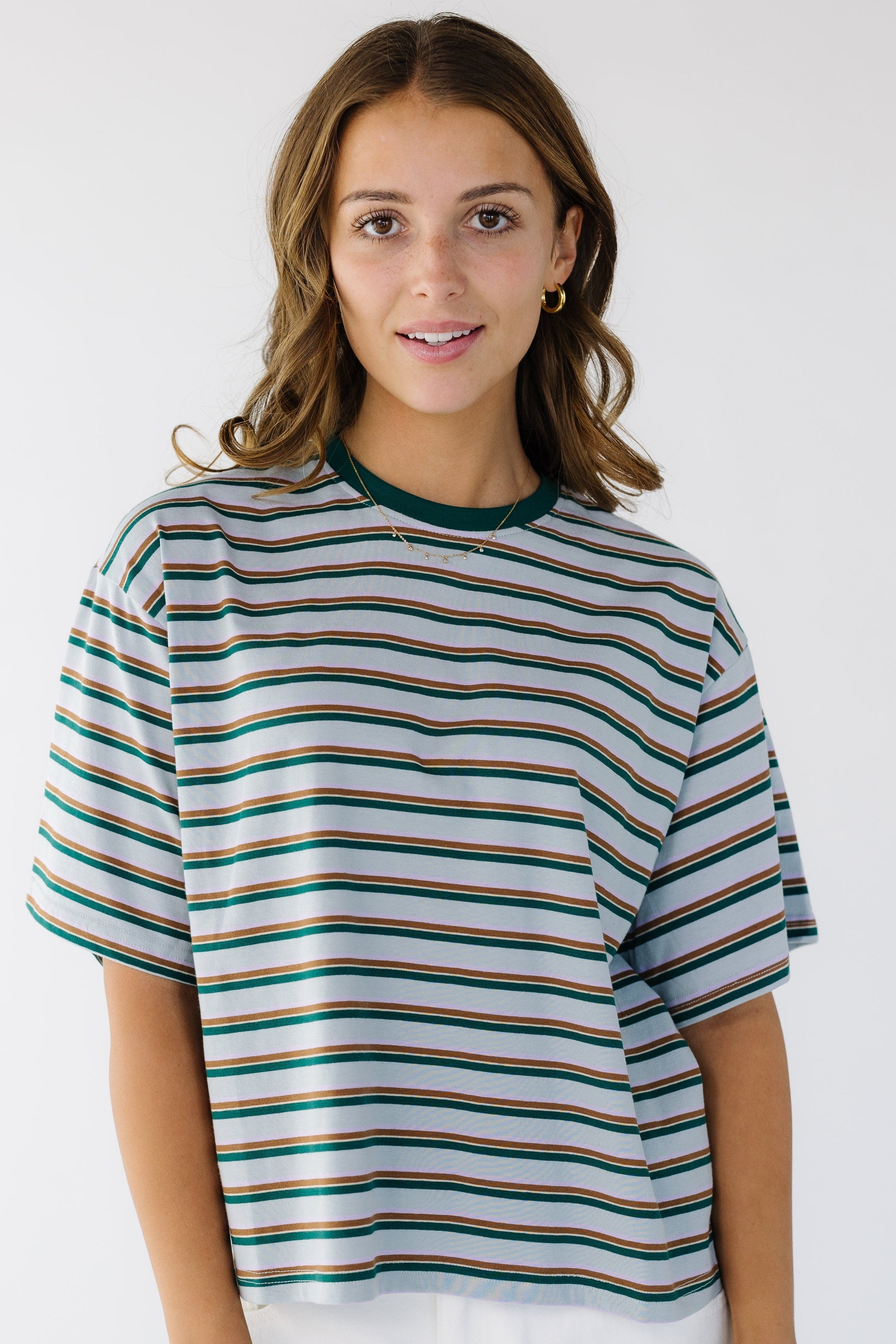 The Stella Top in light blue with green & blue stripes for women and teen girls.