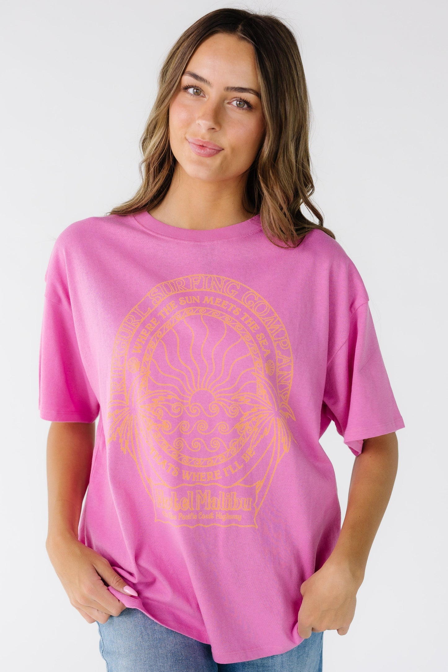 Rip Curl Hotel Malibu Heritage Tee for women and teens in bright pink with a large front graphic for women and teens.