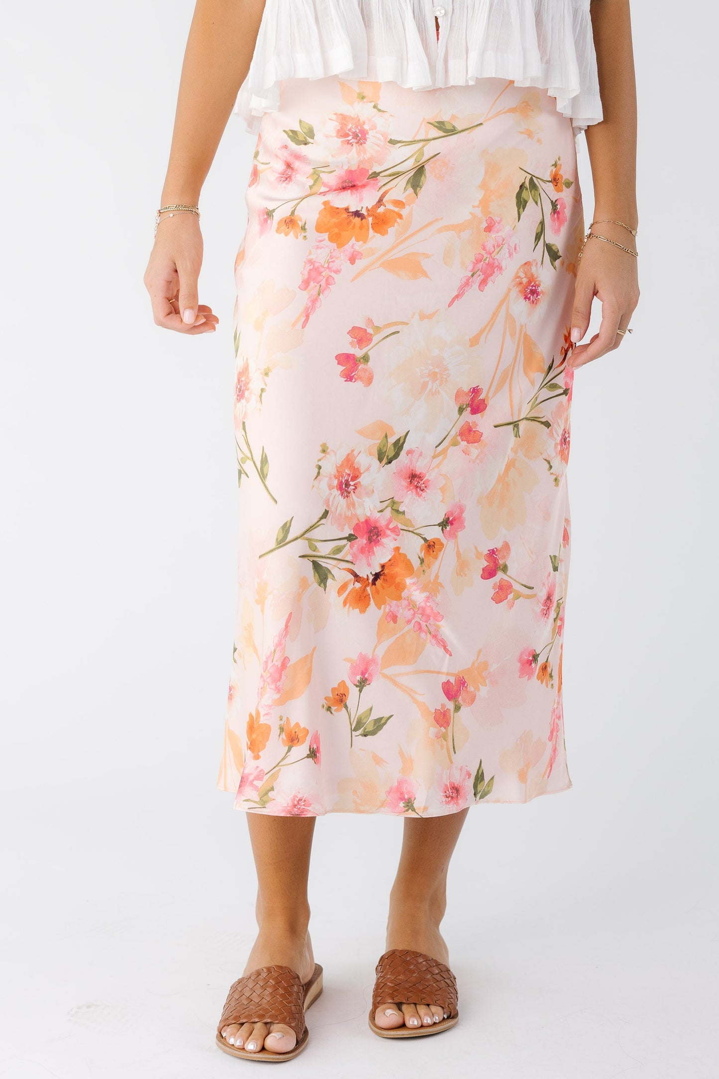 young woman wearing a pink floral A-line midi skirt 