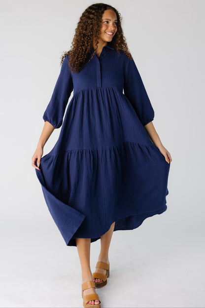 Teen girl wearing a navy midi with a very full skirt