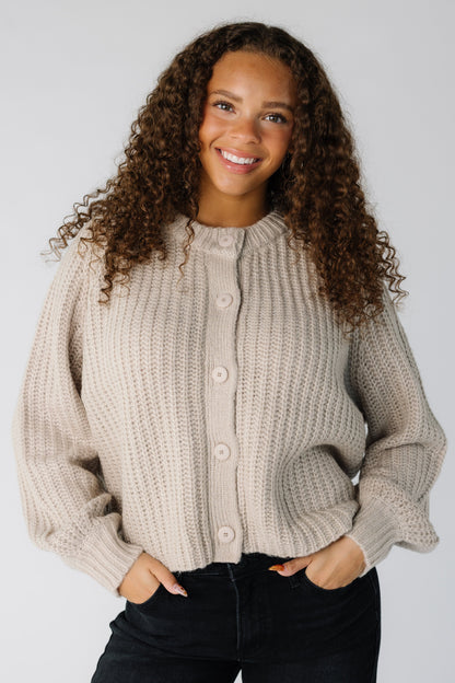 Teen girl wearing a light mocha loose fitting ribbed cardigan