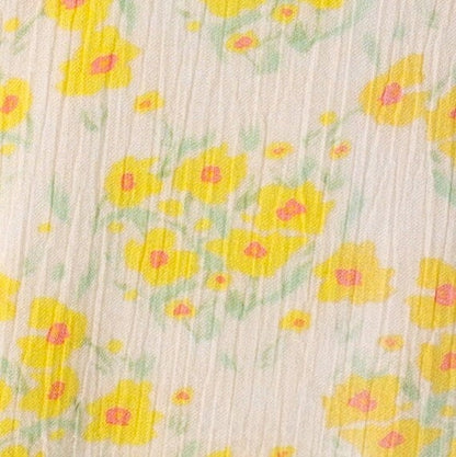 Yellow floral fabric swatch.