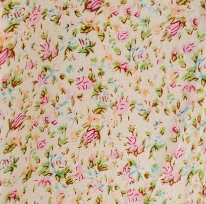 Yellow floral print fabric swatch.
