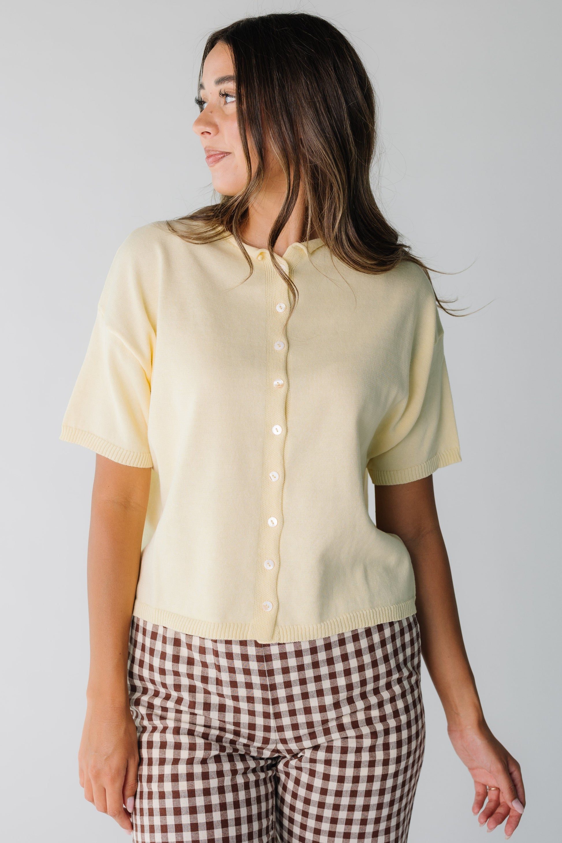 Soft yellow button down knit top with rolled collar