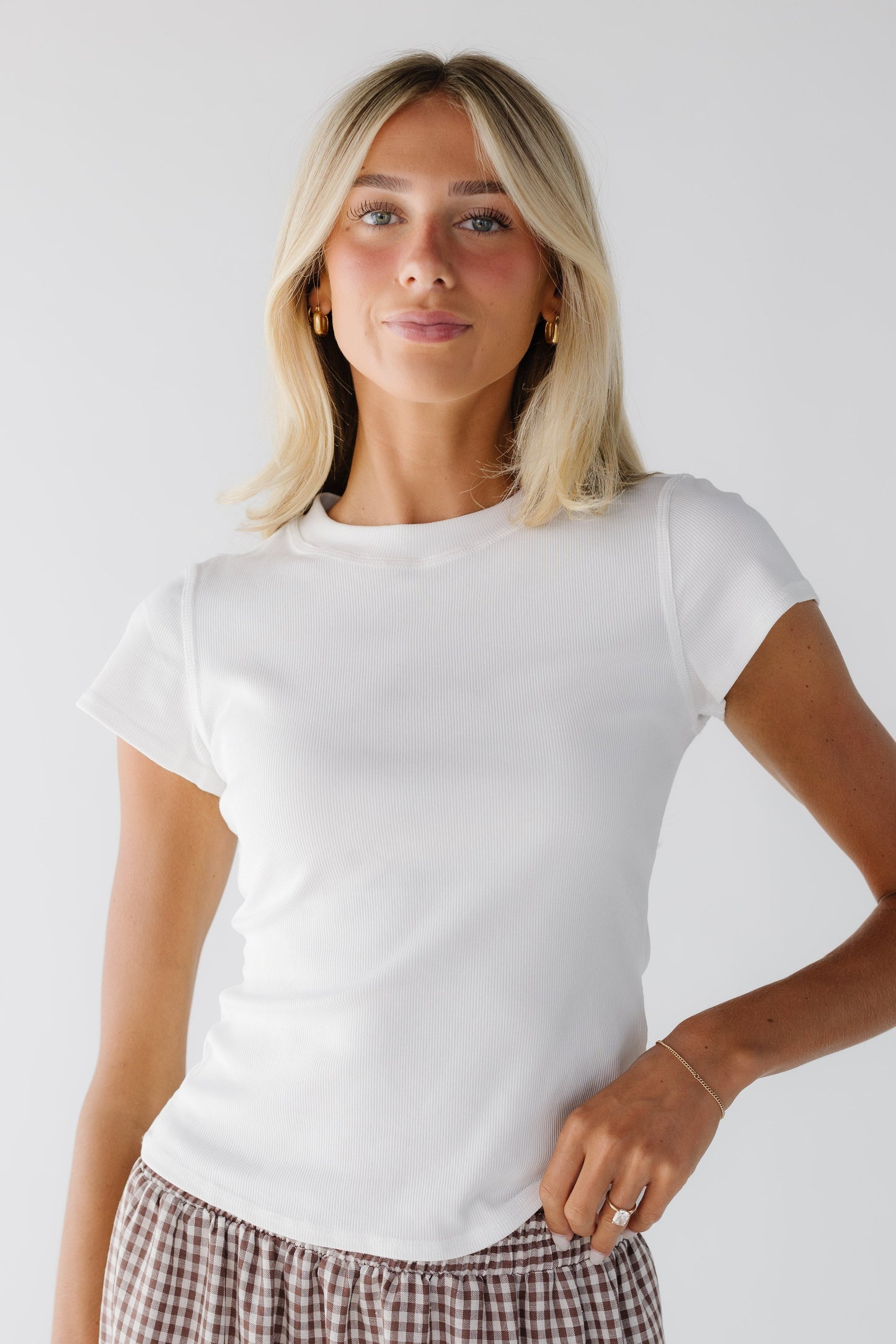 Cassie Knit Top in white with short sleeves and a wide ribbed crew neckline.