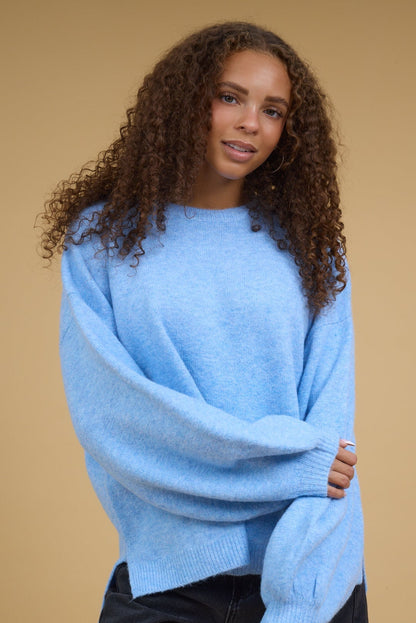 Briar Sweater w/ Side Slit in heathered light blue for women and teenage girls.