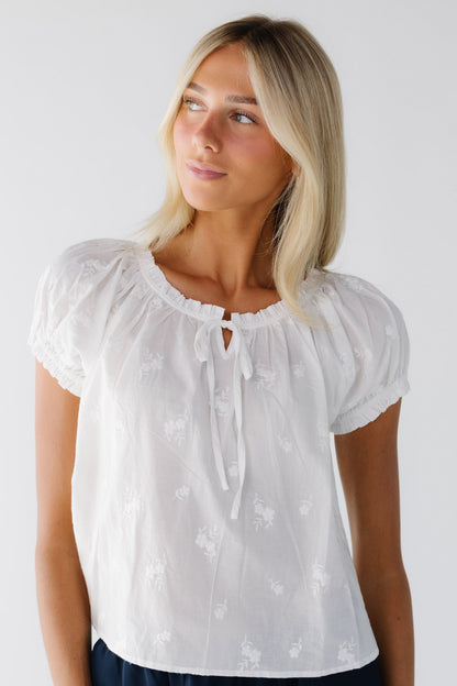 The Kass Embroidery Blouse in white with short puff sleeves for women and teenage girls.