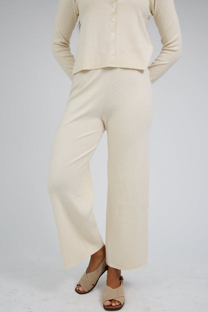 Wide leg pointelle knit pant with matching long sleeve cardigan.