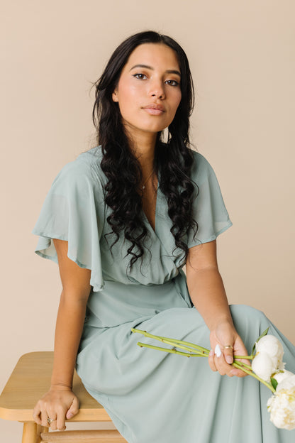 Close view of dusty green wrap maxi dress