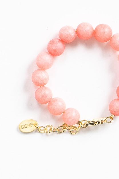 Baby bracelet with large round pink beads