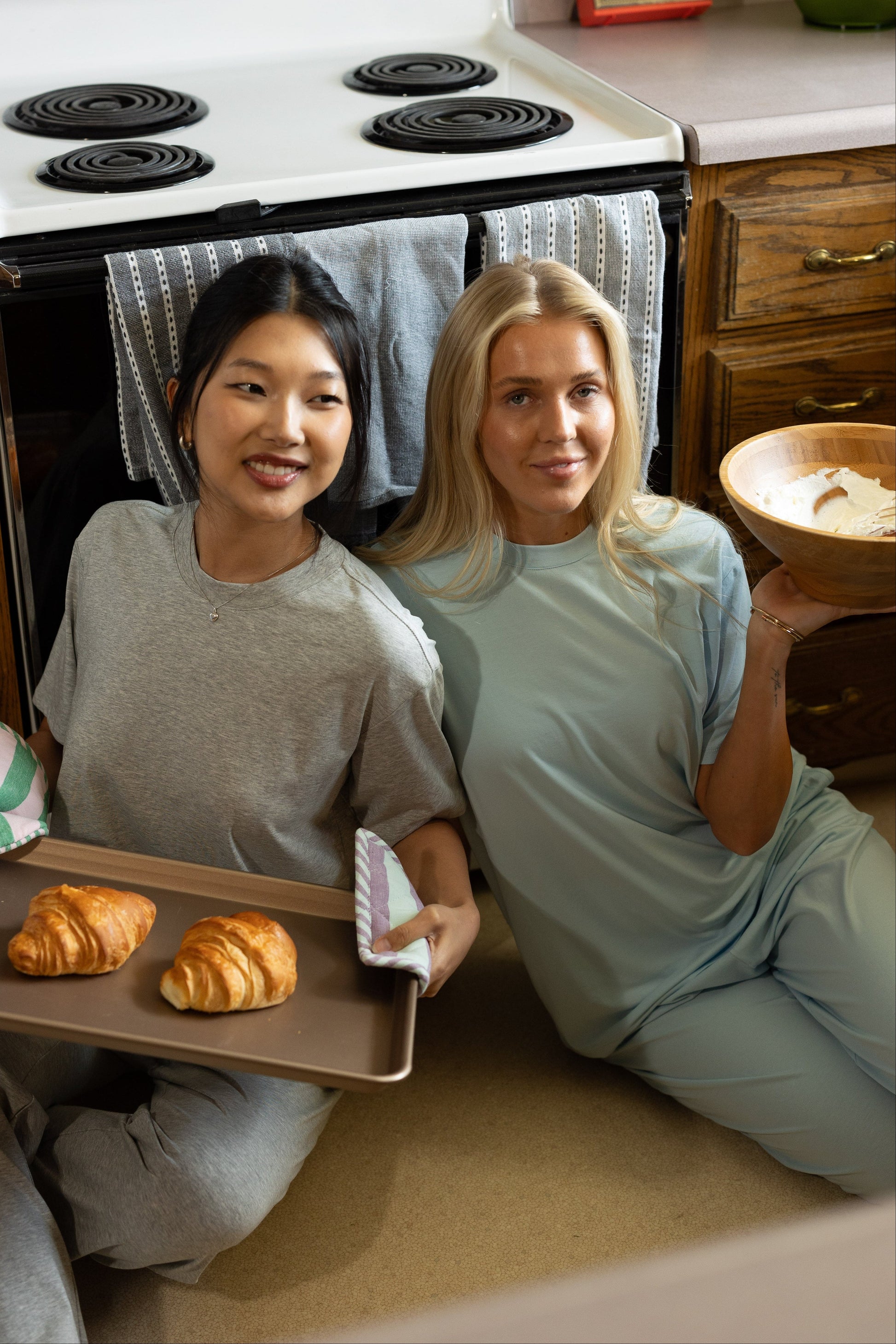 Women wearing a grey lounge set and a light blue lounge set
