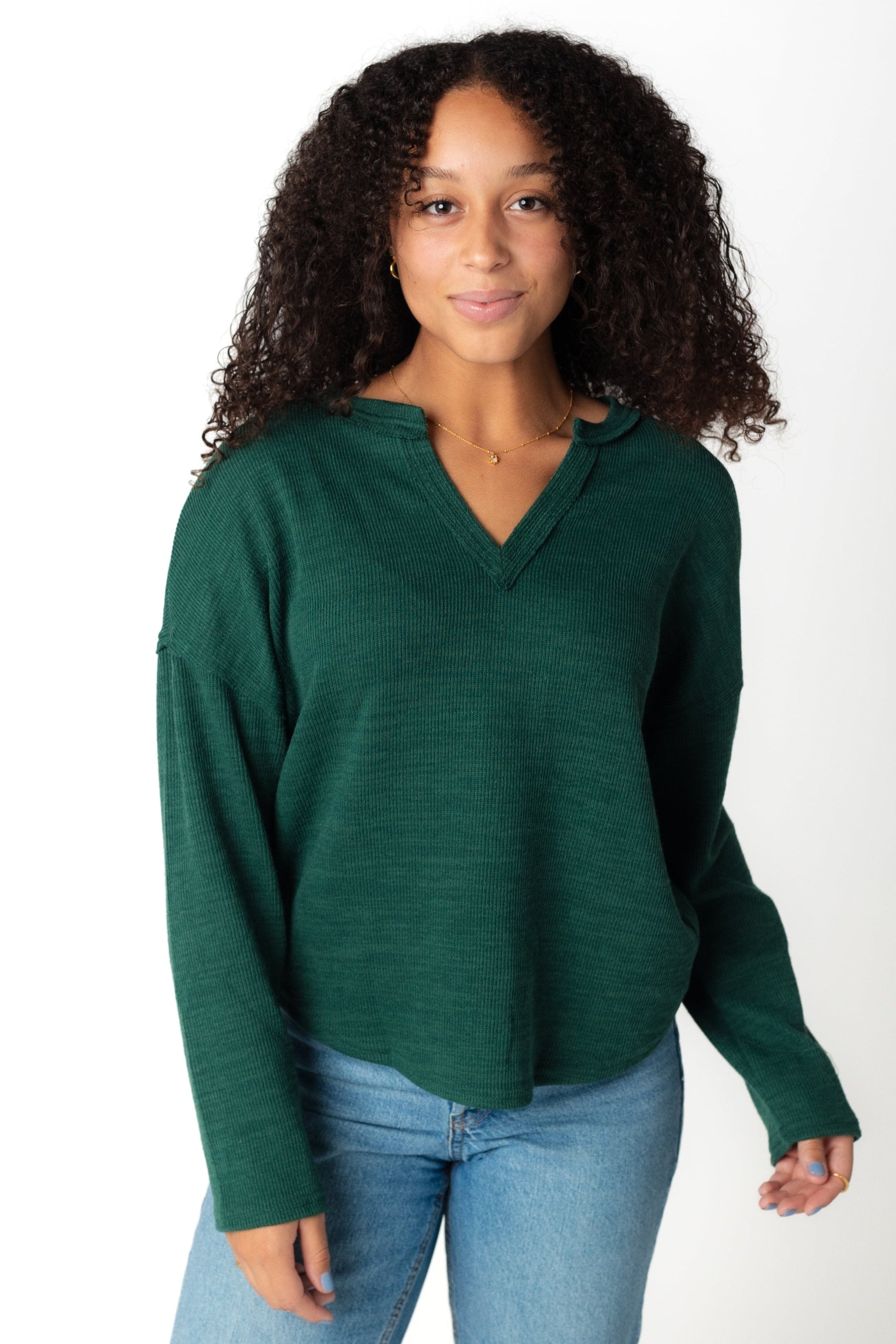 V-neck green sweater with long sleeves