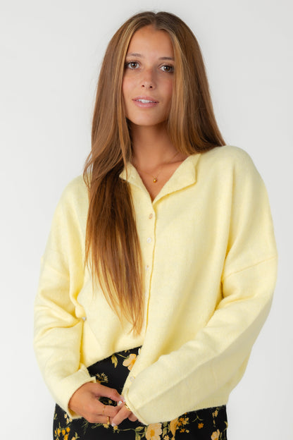Modest women's yellow button down cardigan with rolled collar and long sleeves