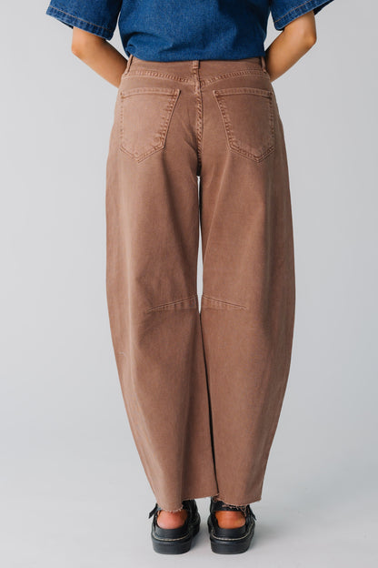 Back view of women wearing brown very wide leg jeans