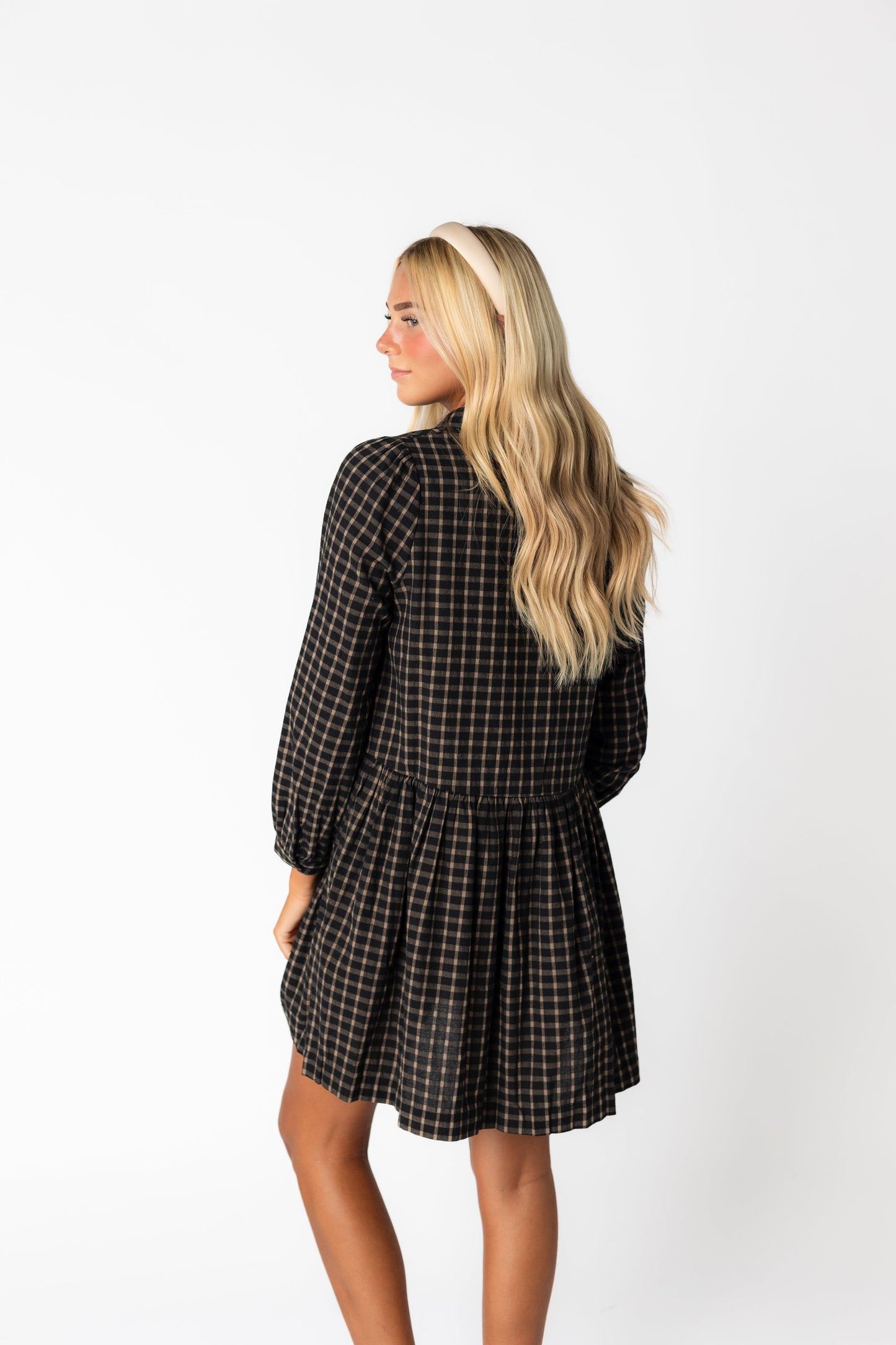 Back view of black and brown plaid short dress