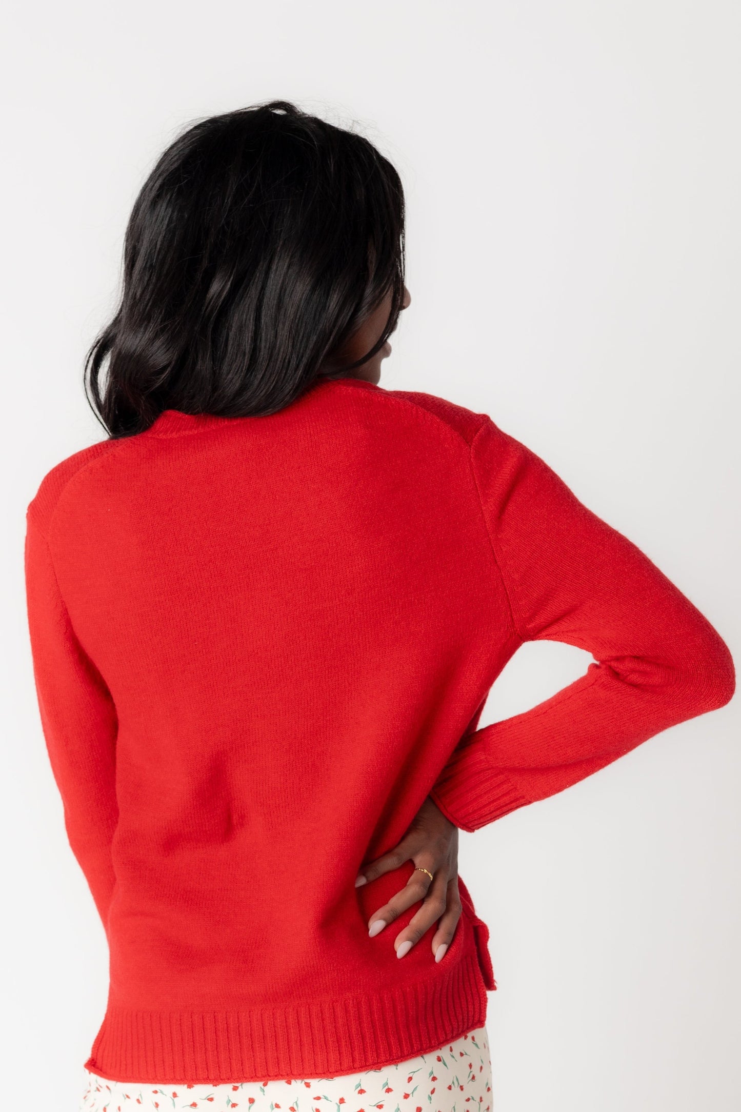 Back view of red long sleeve sweater