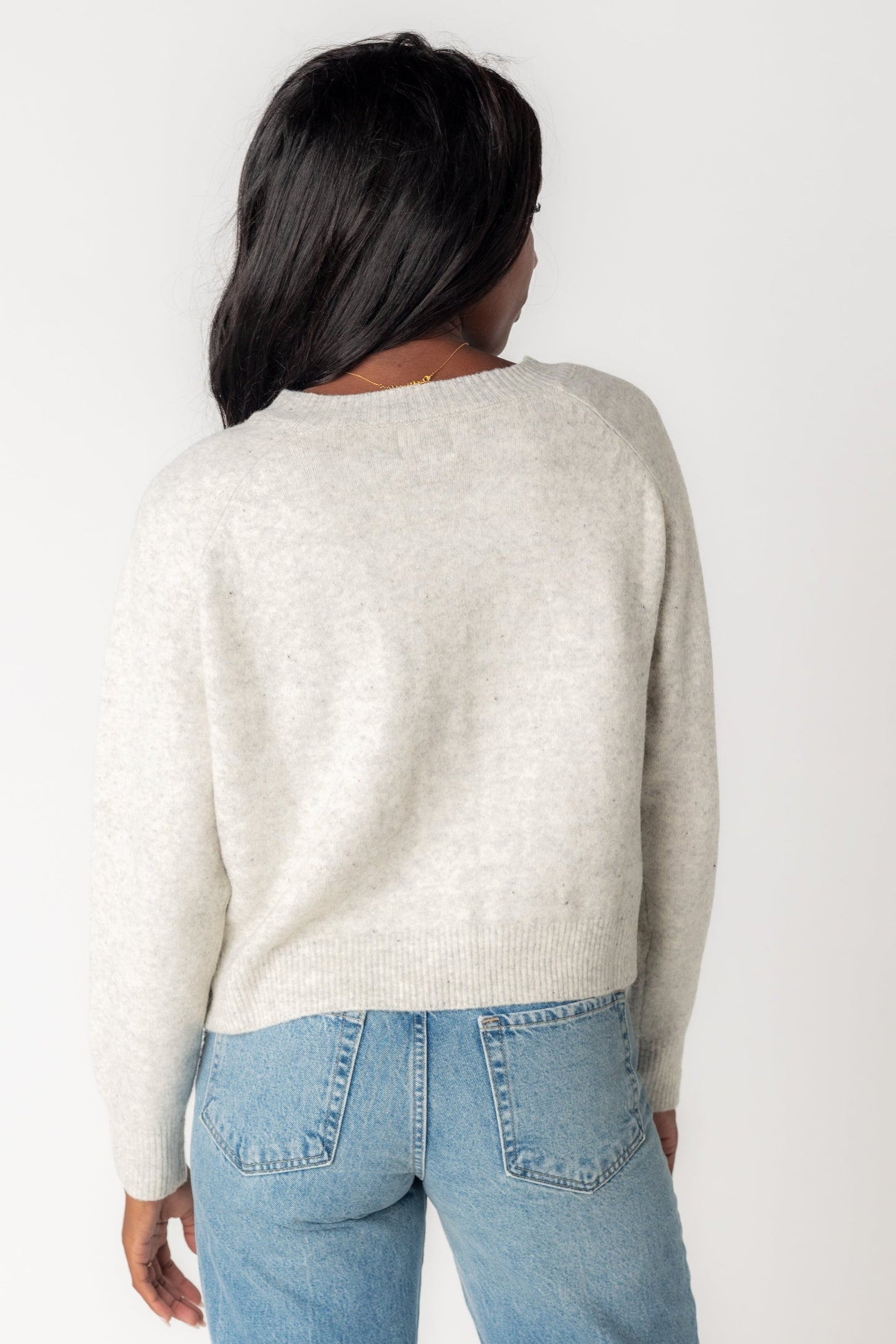 Back view of light grey cardigan with long sleeves