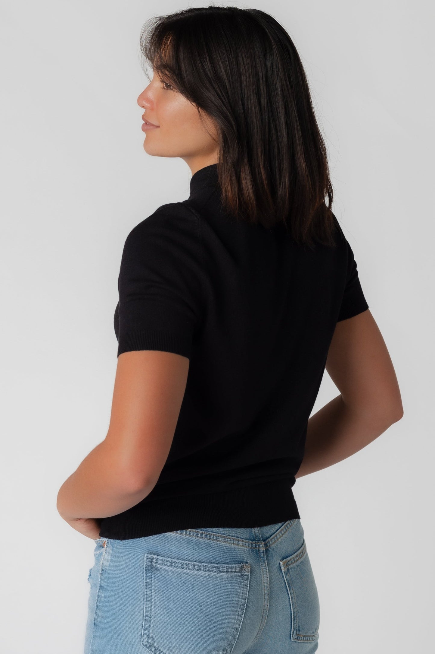 Back view of black short sleeve top