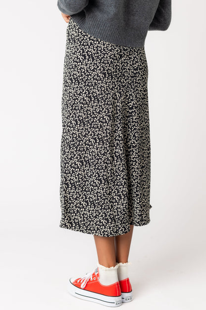 Back view of black and white leopard print A-line midi skirt