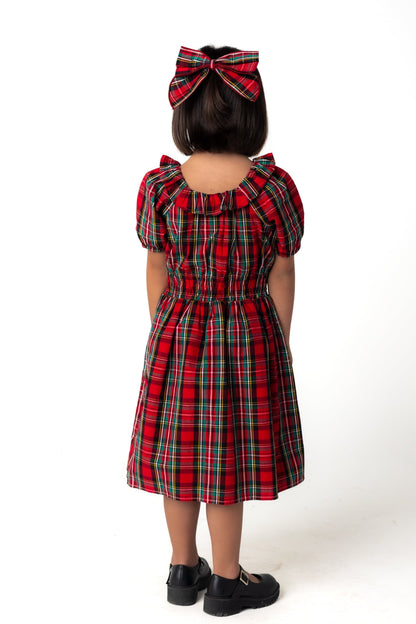 Back view of girl's red plaid holiday midi dress