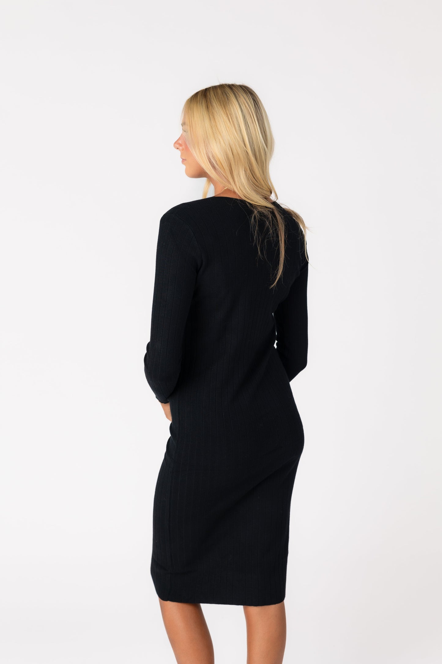 Back view of black ribbed sweater dress