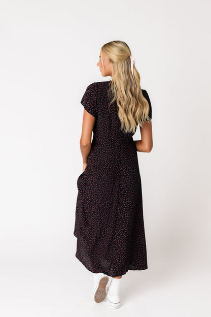 Back view of black floral print midi dress