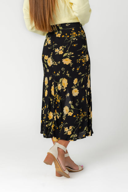 Back view of black floral print midi skirt