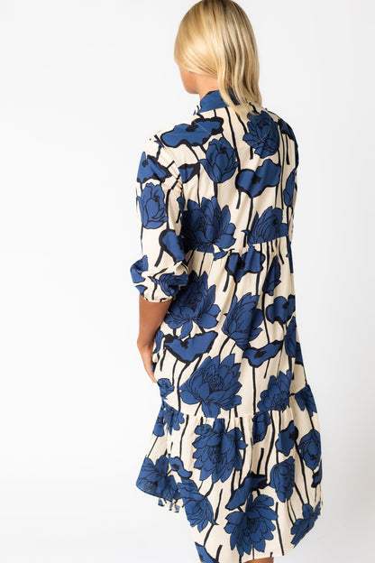 Back view of bold blue print midi dress