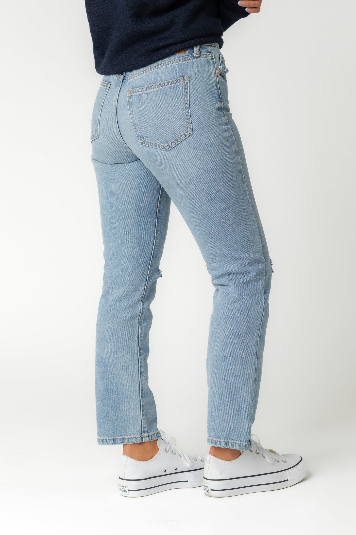 Back view of straight leg medium denim jeans