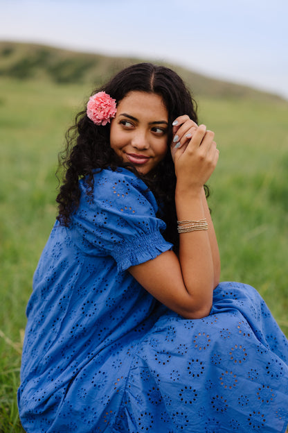 Close view of blue eyelet dress with short sleeves