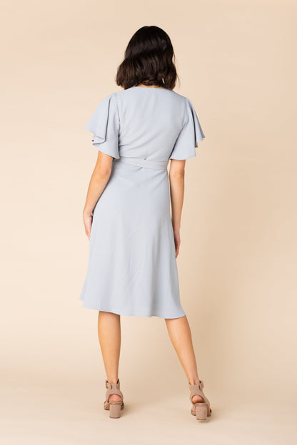 Back view of dusty blue dress with flutter sleeves